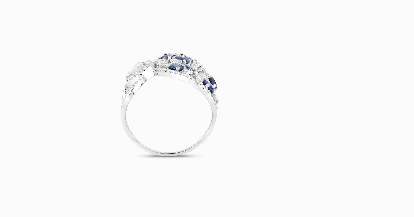 14kt white gold ring with round and pear-shaped diamonds and round-shaped blue sapphire