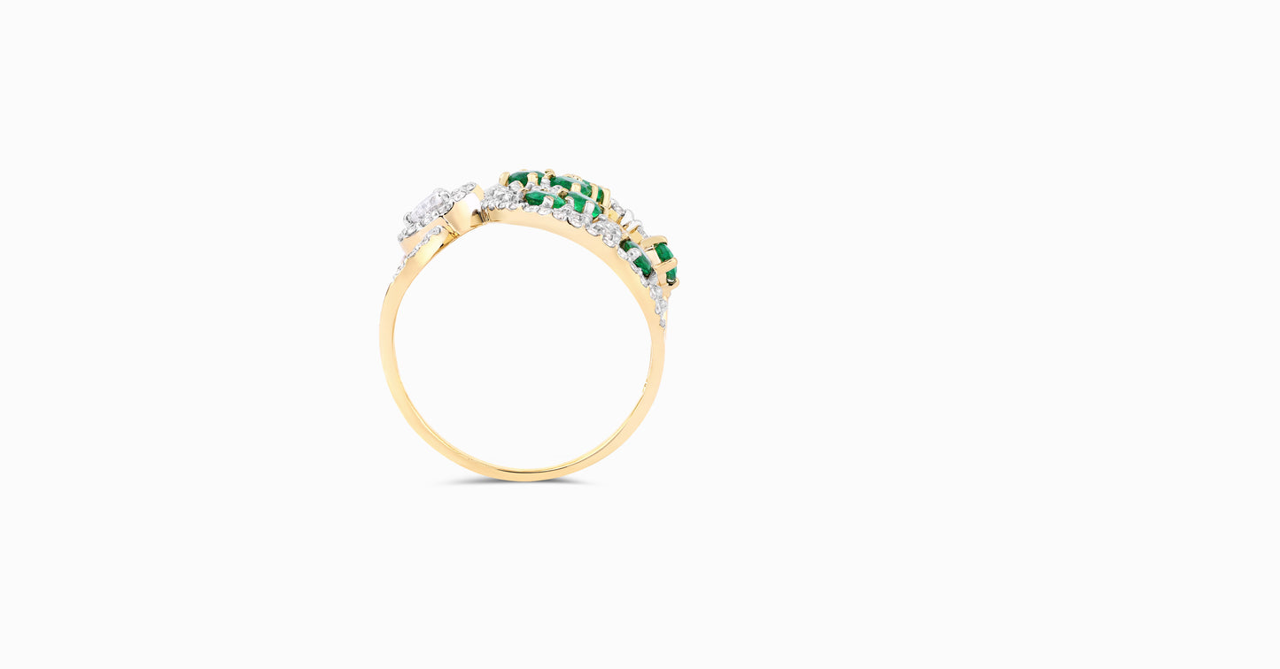 14kt white gold ring with round and pear-shaped diamonds and round-shaped emerald