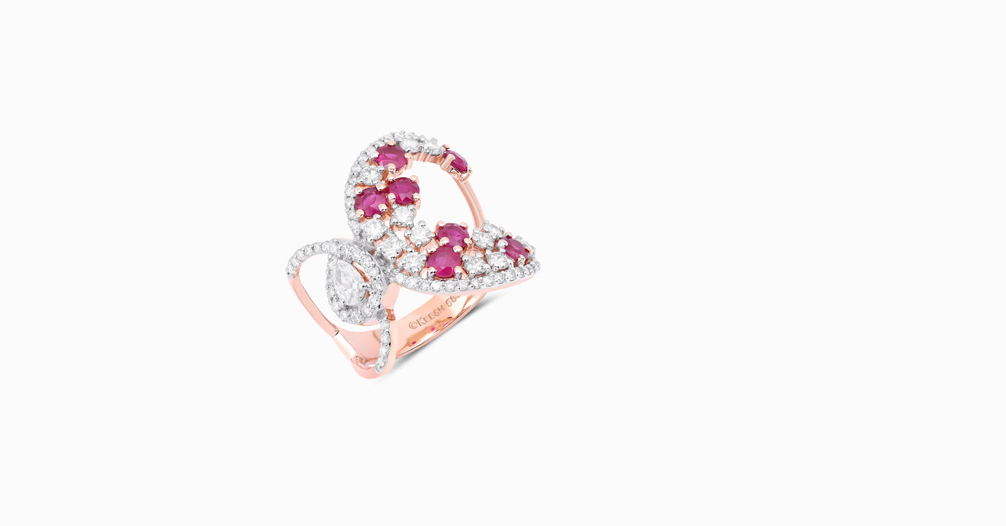 14kt white gold ring with round and pear-shaped diamonds and round-shaped ruby