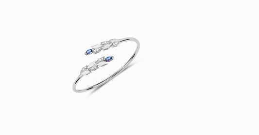 14kt white gold bangle with marquise-shaped sapphire and pave diamonds