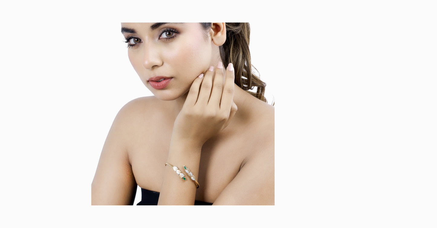 14kt yellow gold bangle with marquise-shaped emerald and pave diamonds