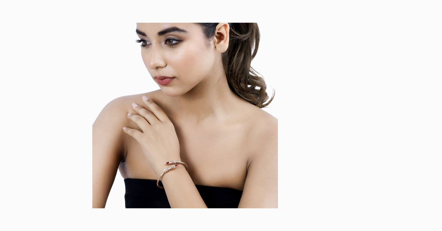 14kt rose gold bangle with marquise-shaped ruby and pave diamonds