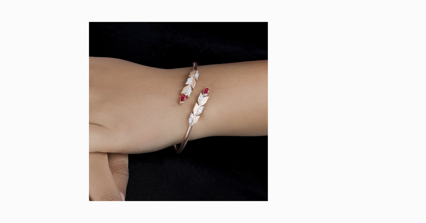 14kt rose gold bangle with marquise-shaped ruby and pave diamonds