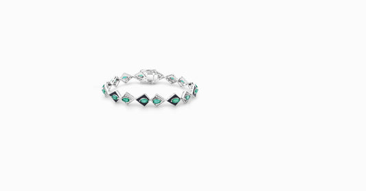 14kt white gold bracelet with round-shaped diamonds and marquise-shaped emerald