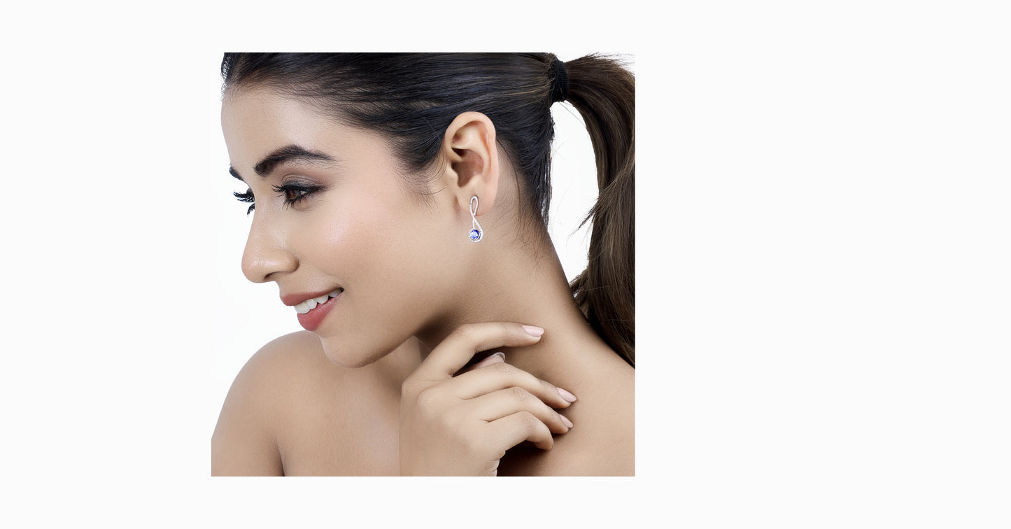 14kt white gold earrings with round-shaped tanzanite and pave diamonds