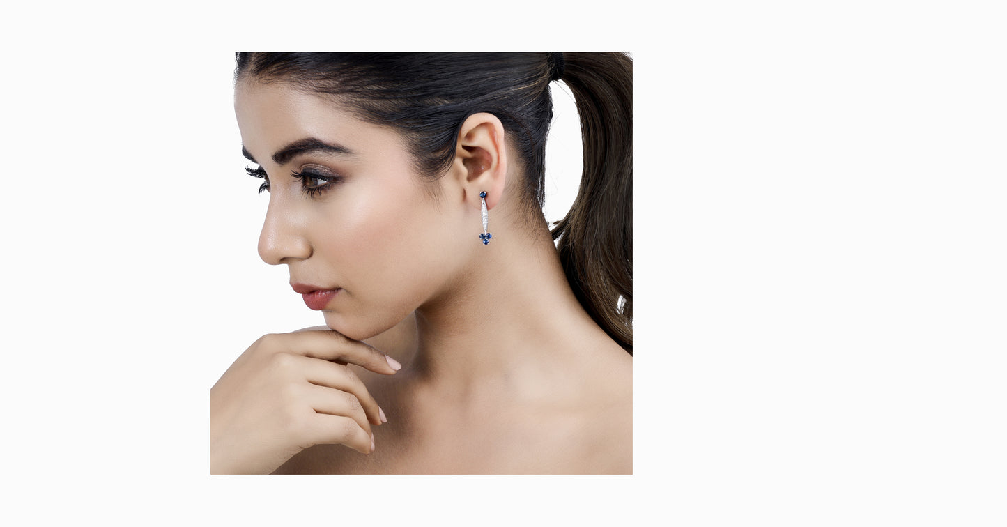 14kt white gold earrings with round-shaped sapphire and pave diamonds