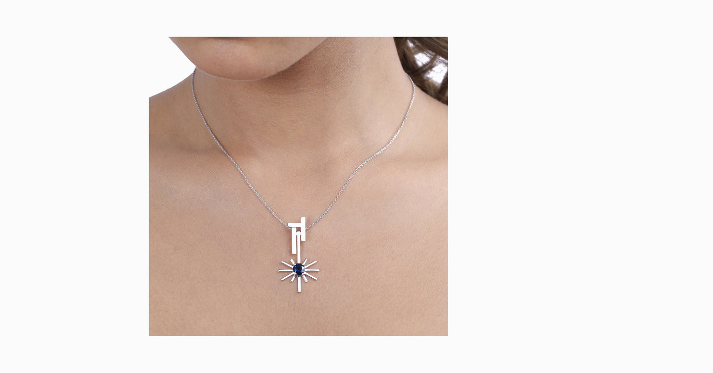 14kt white gold pendant with round-shaped blue sapphire