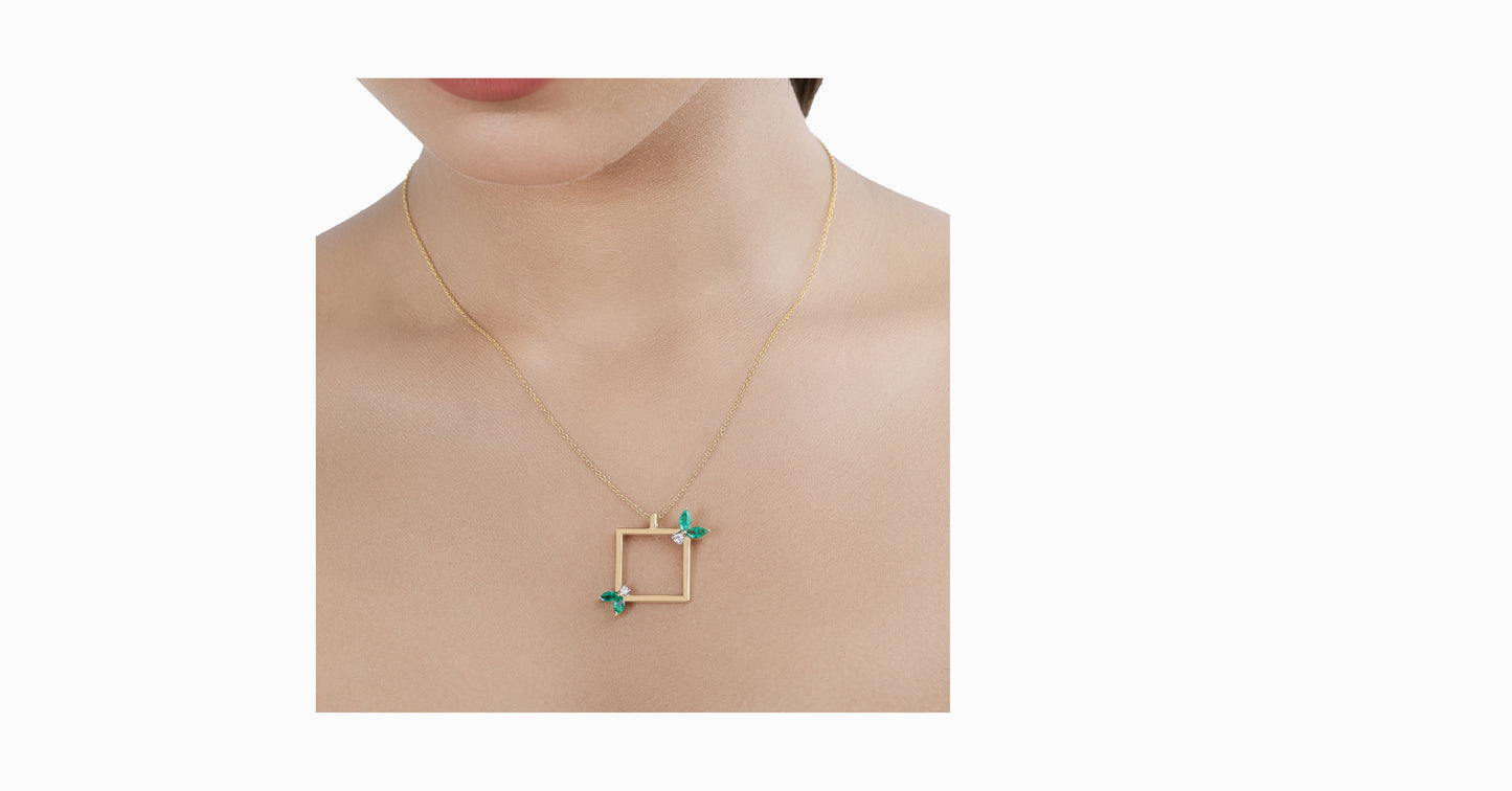 14kt yellow gold pendant with marquise-shaped emerald and diamonds