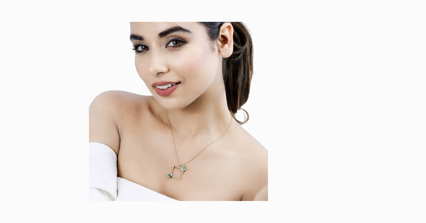 14kt yellow gold pendant with marquise-shaped emerald and diamonds