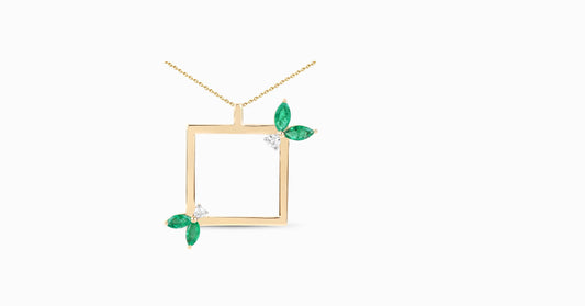 14kt yellow gold pendant with marquise-shaped emerald and diamonds