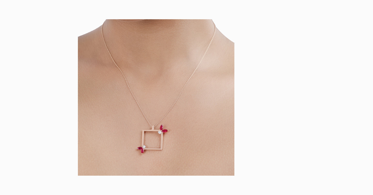 14kt rose gold pendant with marquise-shaped ruby and diamonds