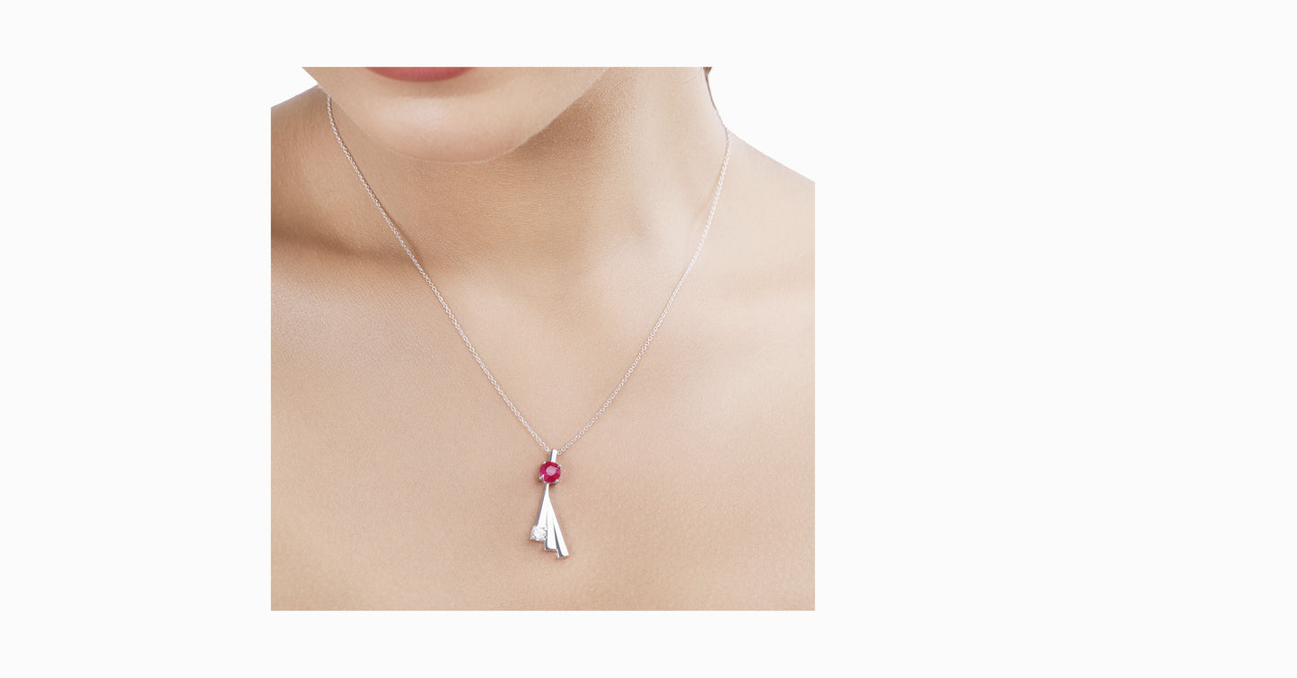14kt white gold pendant with round-shaped ruby and diamond