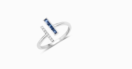 14kt white gold ring with baguette-shaped sapphire and pave diamonds