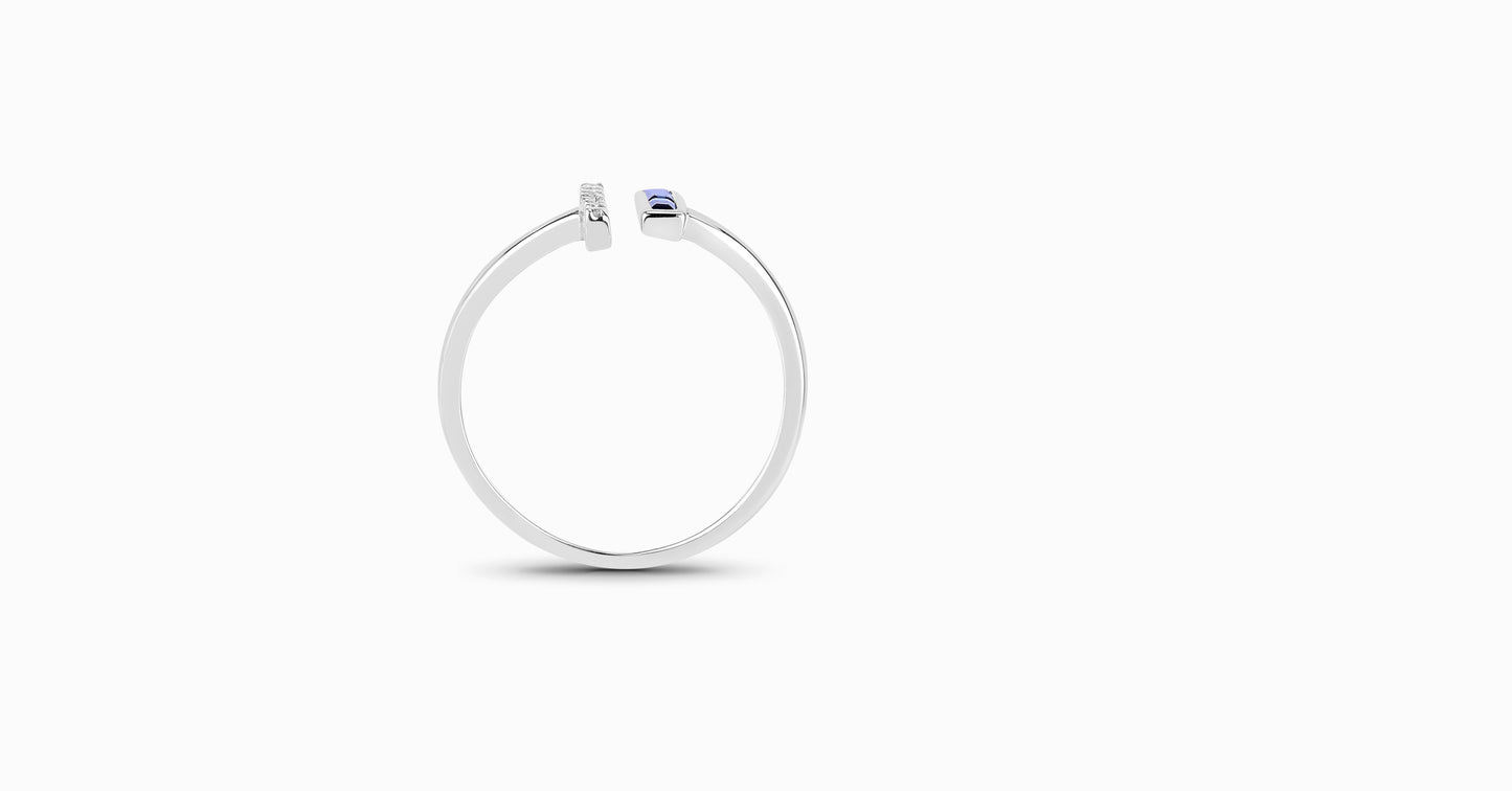 14kt white gold ring with baguette-shaped sapphire and pave diamonds