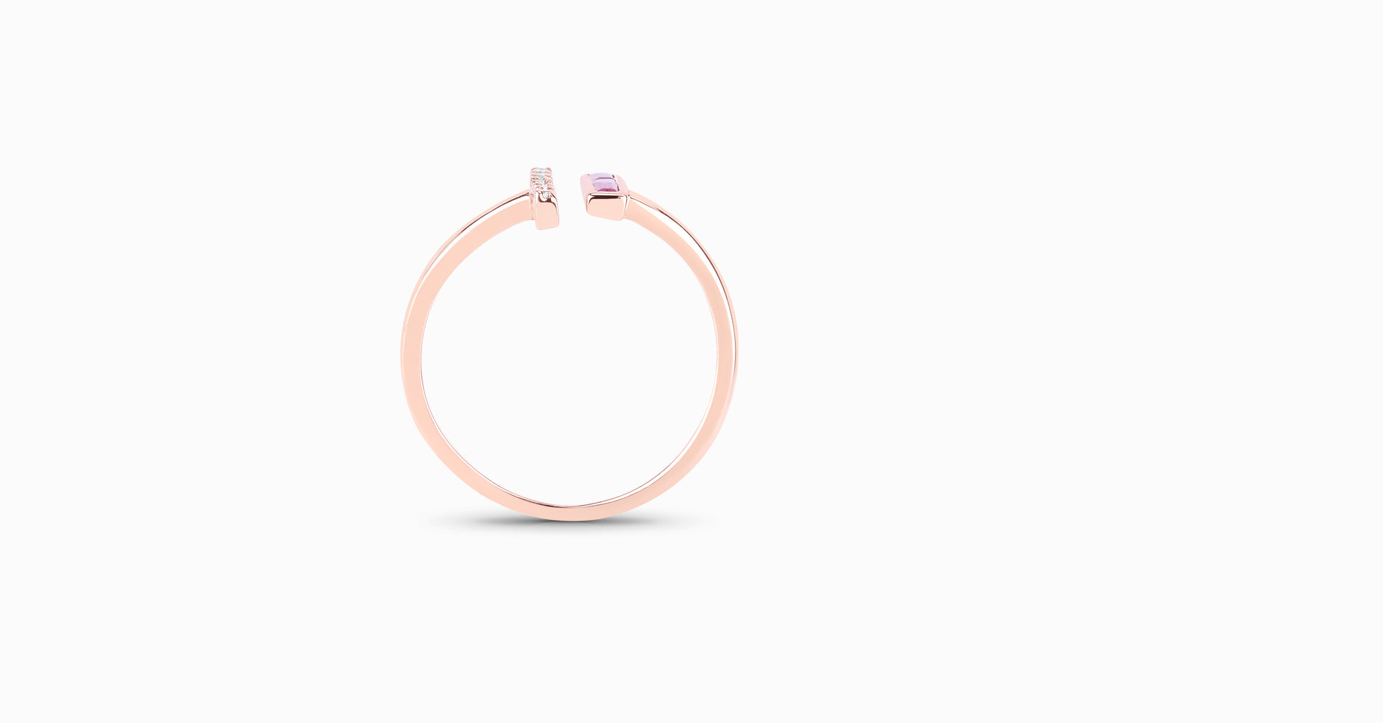14kt rose gold ring with baguette-shaped ruby and pave diamonds