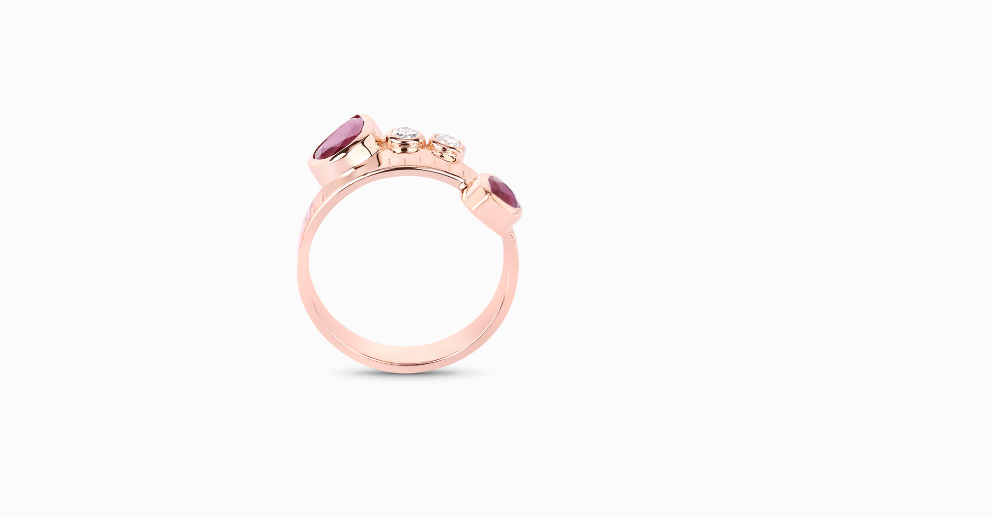 14kt rose gold ring with pear-shaped ruby and bezel diamonds