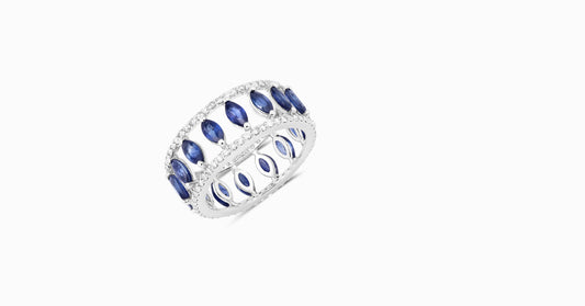 14kt white gold ring with round-shaped diamonds and marquise-shaped blue sapphire