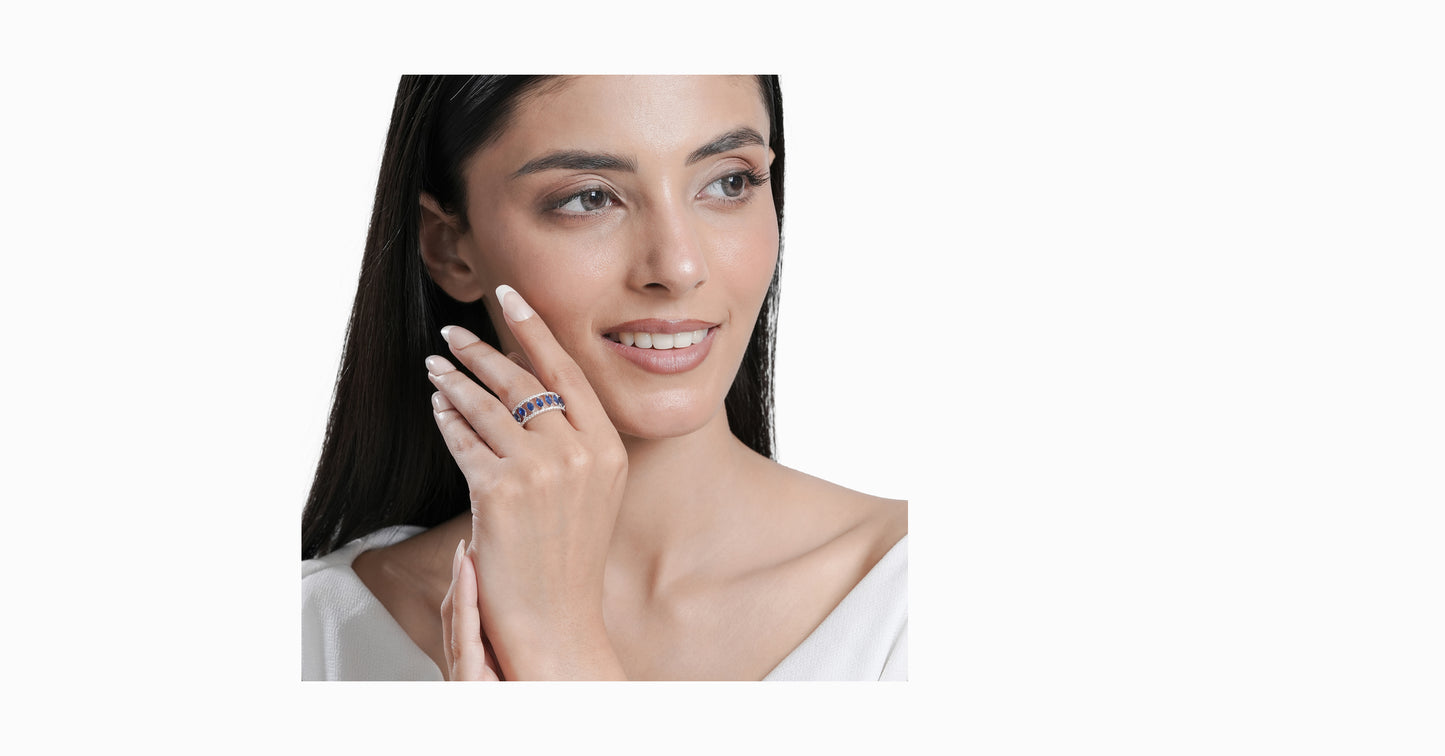 14kt white gold ring with round-shaped diamonds and marquise-shaped blue sapphire