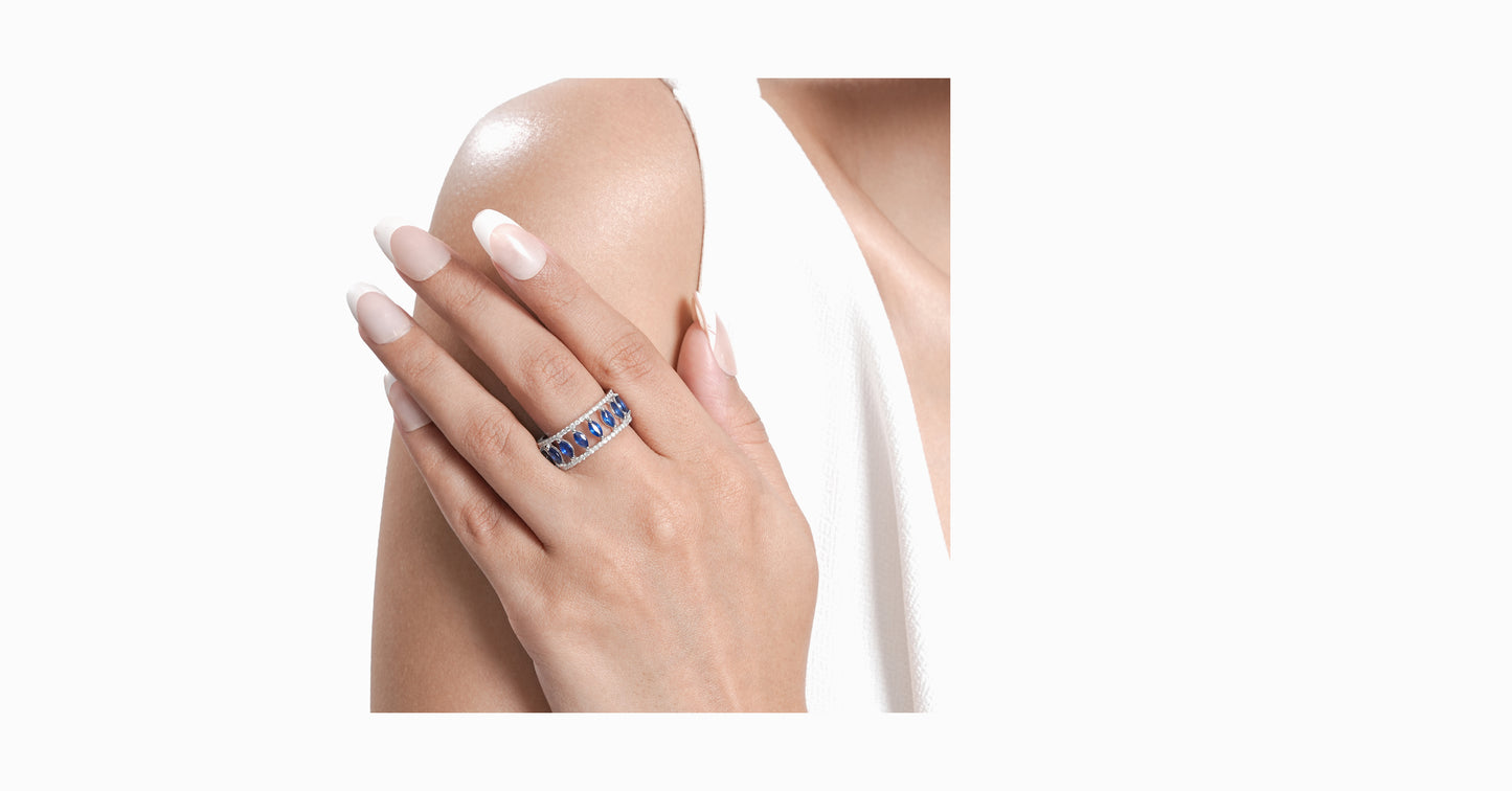 14kt white gold ring with round-shaped diamonds and marquise-shaped blue sapphire