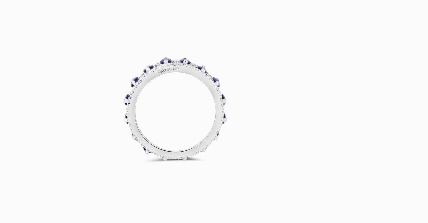14kt white gold ring with round-shaped diamonds and marquise-shaped blue sapphire