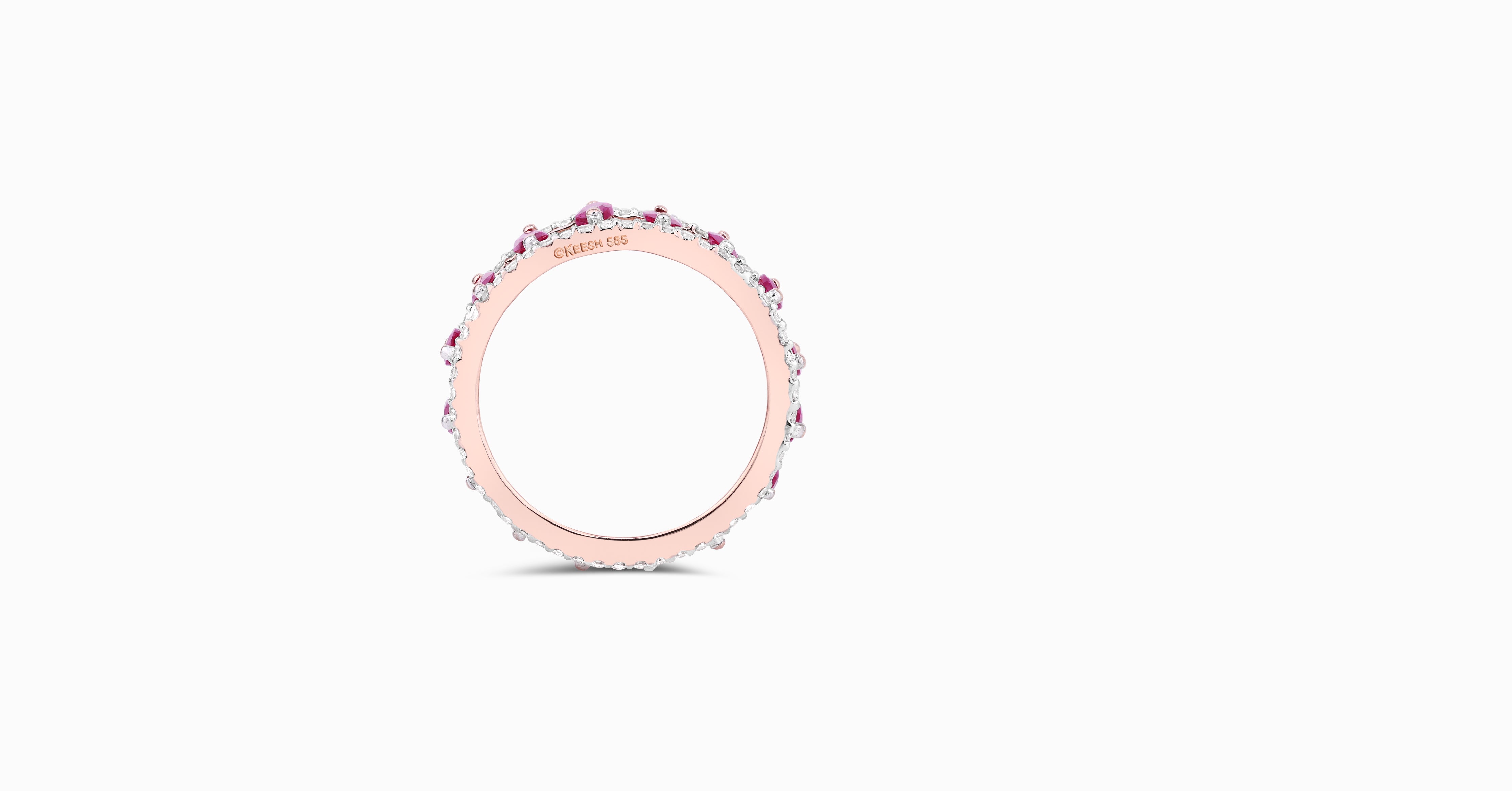 14kt rose gold ring with round-shaped diamonds and marquise-shaped ruby