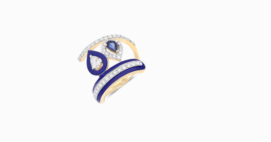 14kt yellow gold ring with round and pear-shaped diamonds and pear-shaped blue sapphire