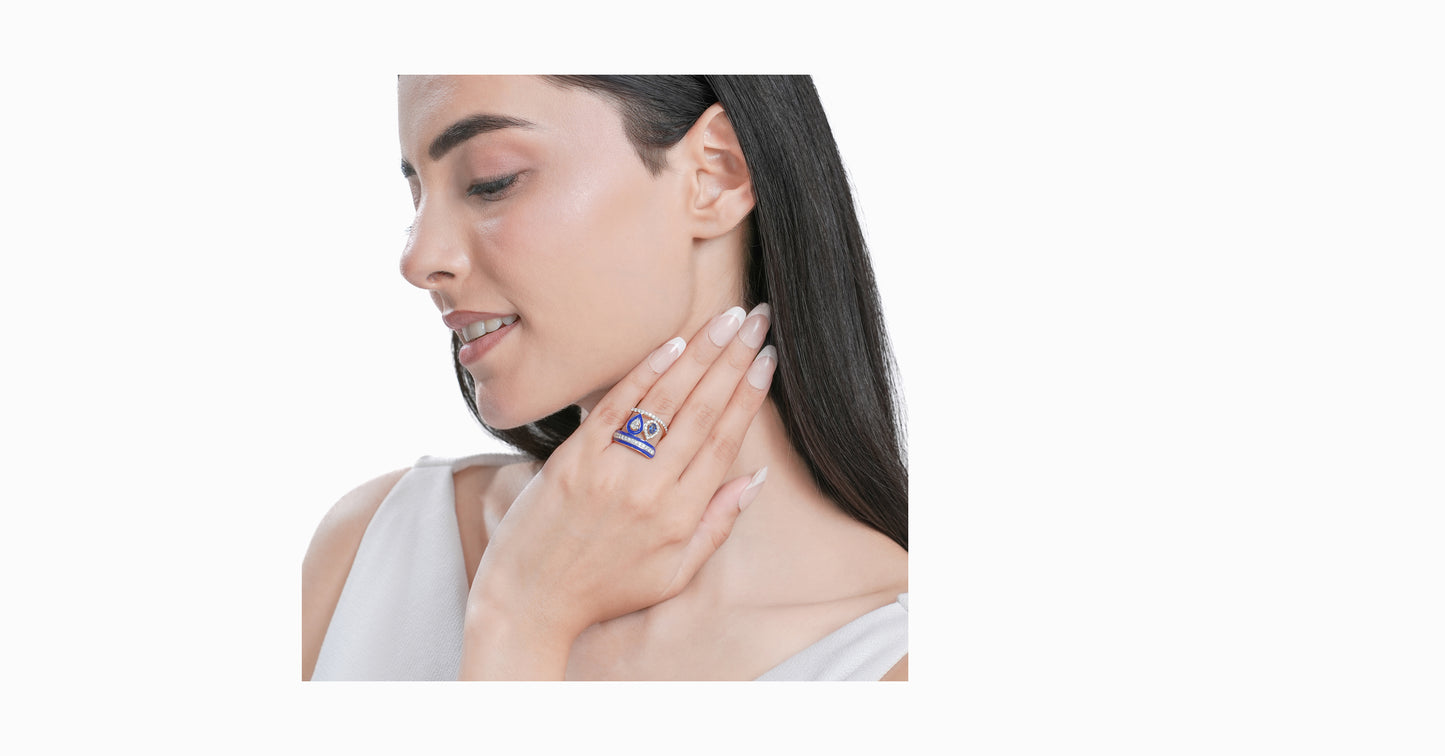 14kt yellow gold ring with round and pear-shaped diamonds and pear-shaped blue sapphire