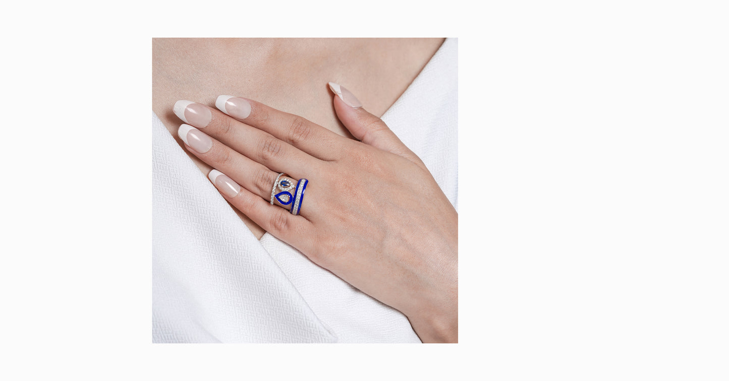 14kt yellow gold ring with round and pear-shaped diamonds and pear-shaped blue sapphire