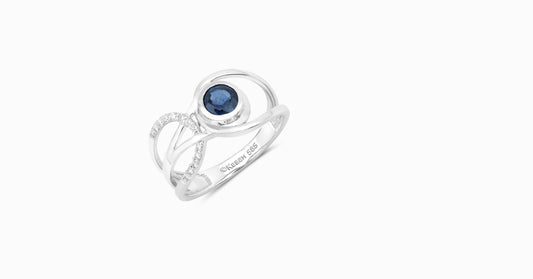 14kt white gold ring with round-shaped diamonds and round-shaped blue sapphire