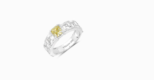 14kt white gold ring with round and baguette-shaped diamonds and cushion-cut natural yellow diamond