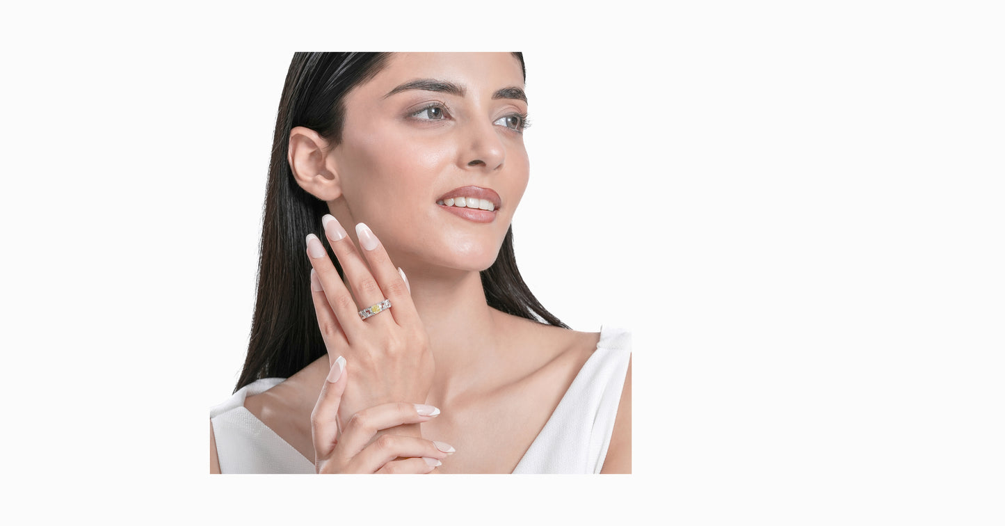 14kt white gold ring with round and baguette-shaped diamonds and cushion-cut natural yellow diamond