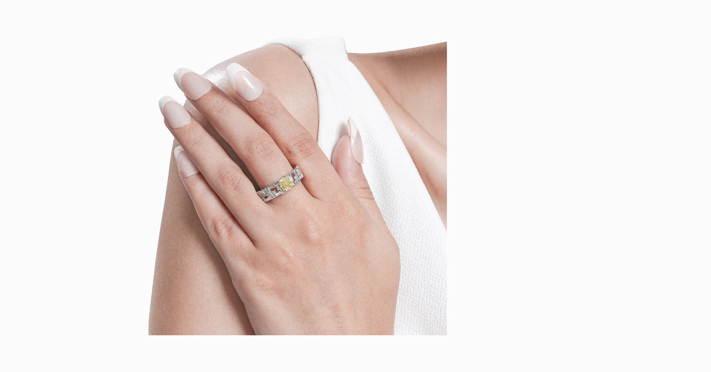 14kt white gold ring with round and baguette-shaped diamonds and cushion-cut natural yellow diamond