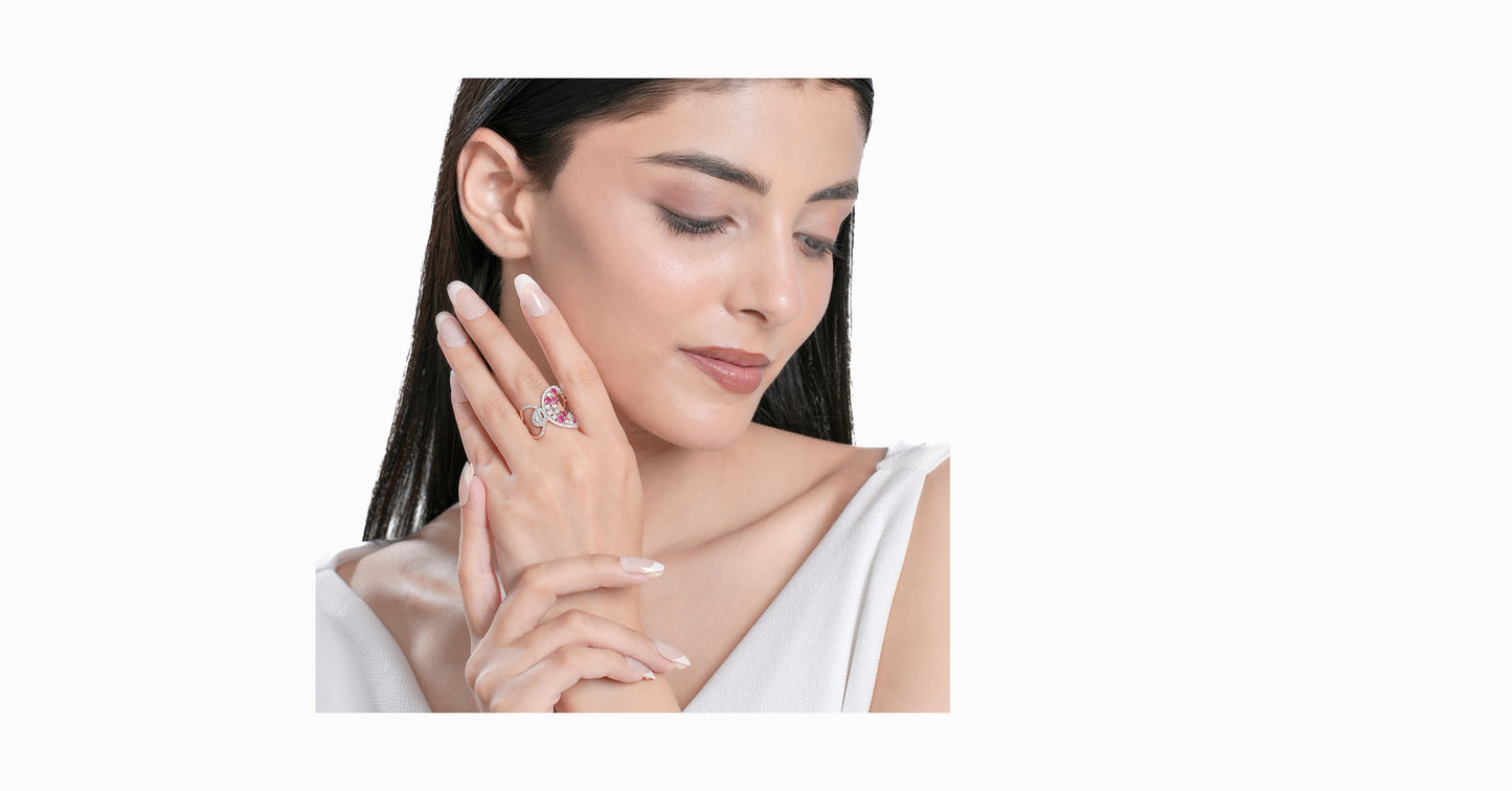 14kt white gold ring with round and pear-shaped diamonds and round-shaped ruby