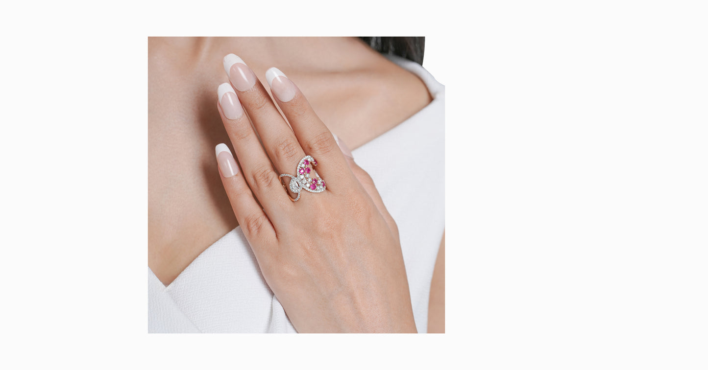 14kt white gold ring with round and pear-shaped diamonds and round-shaped ruby