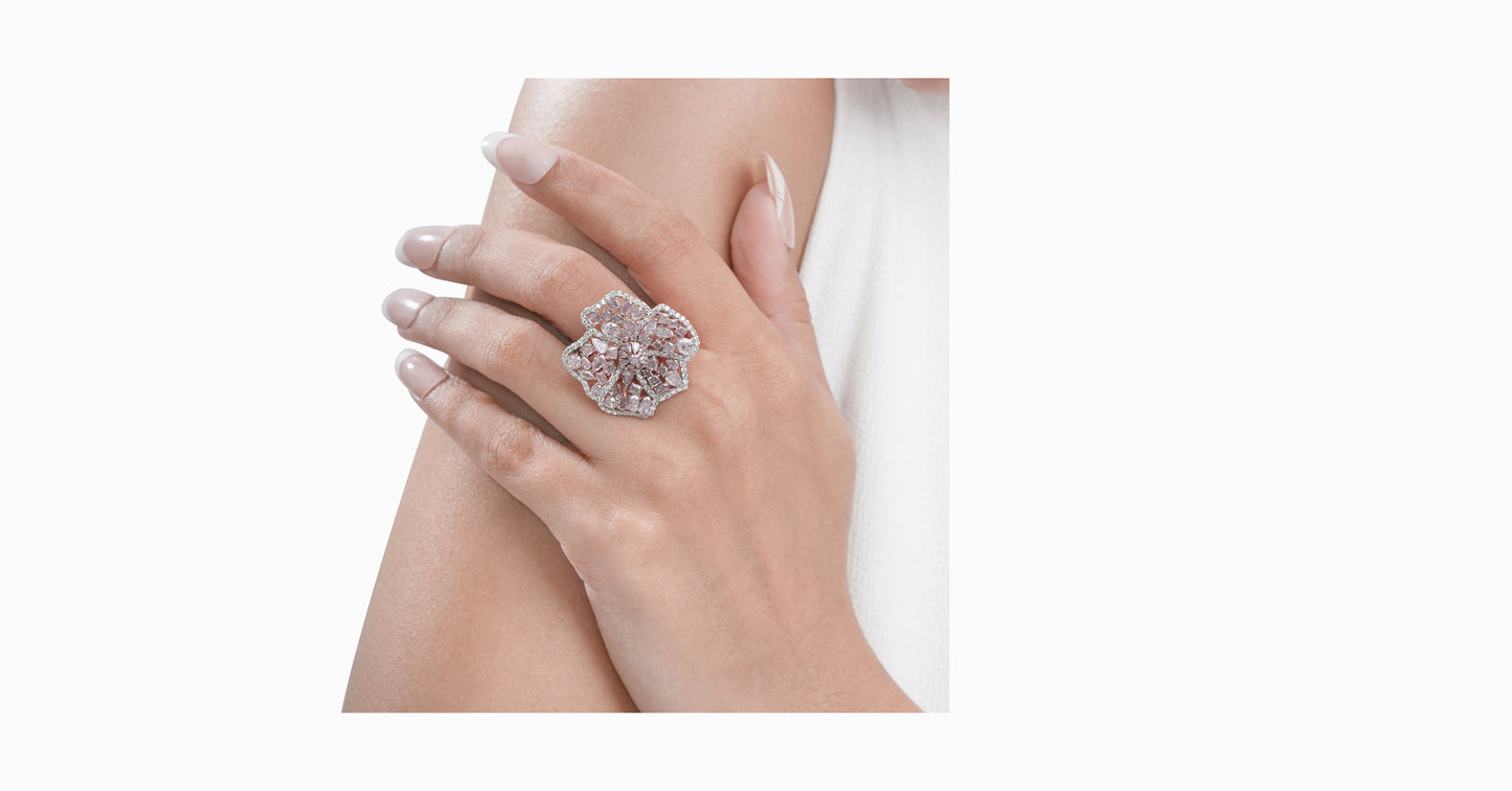 18kt rose gold ring with round-shaped white diamonds and mixed fancy-shaped natural pink diamonds