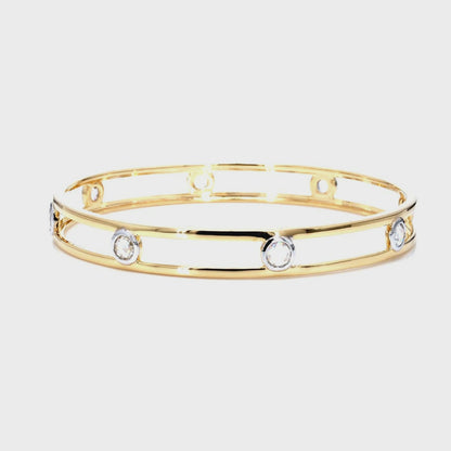 14kt yellow gold bangle with round-shaped bezel diamonds