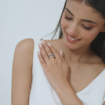 14kt white gold ring with round-shaped diamonds and marquise-shaped blue sapphire