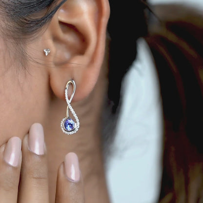 14kt white gold earrings with round-shaped tanzanite and pave diamonds