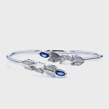 14kt white gold bangle with marquise-shaped sapphire and pave diamonds