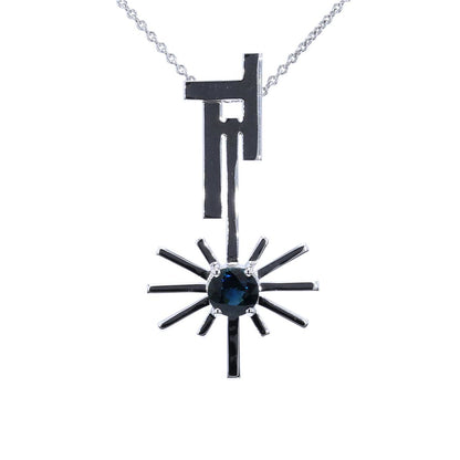 14kt white gold pendant with round-shaped blue sapphire