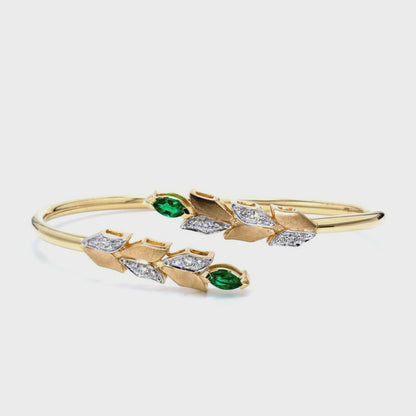 14kt yellow gold bangle with marquise-shaped emerald and pave diamonds